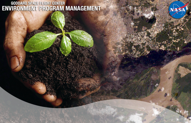 soil and plant held by a pair of hands